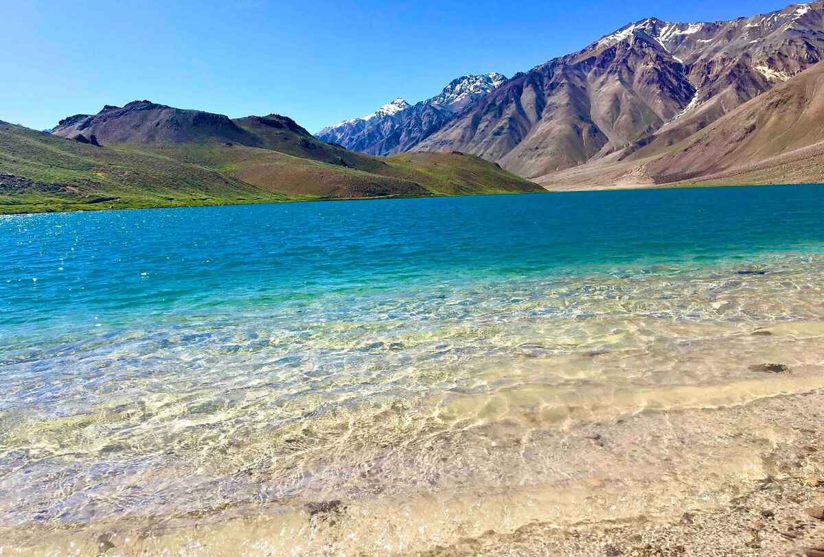 A lake that runs blue, green, turquoise and beige